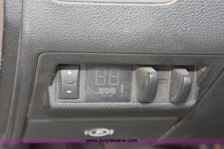 image for item K8916 2011 Dodge Ram 3500HD Quad Cab flatbed pickup truck