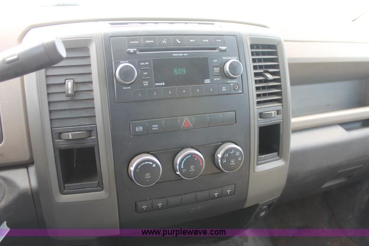 image for item K8916 2011 Dodge Ram 3500HD Quad Cab flatbed pickup truck