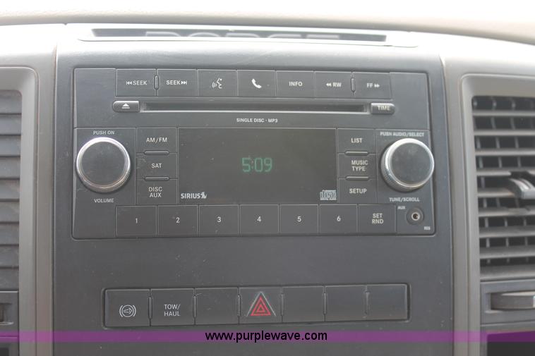 image for item K8916 2011 Dodge Ram 3500HD Quad Cab flatbed pickup truck