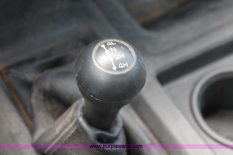 image for item K8916 2011 Dodge Ram 3500HD Quad Cab flatbed pickup truck