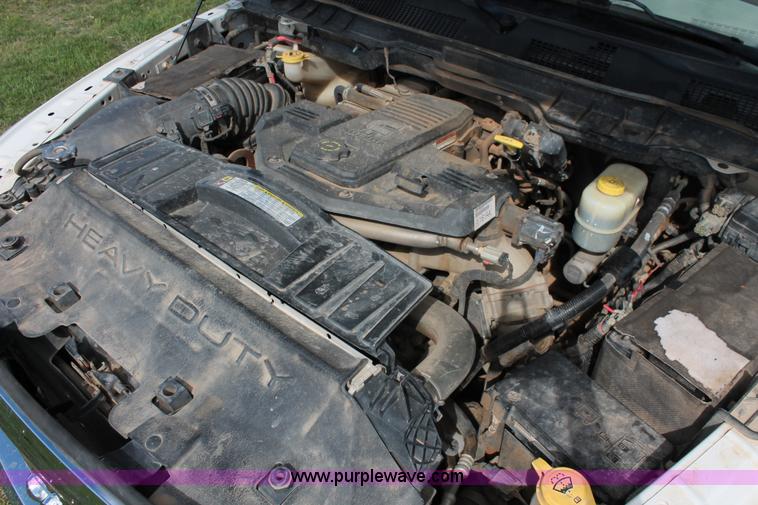 image for item K8916 2011 Dodge Ram 3500HD Quad Cab flatbed pickup truck