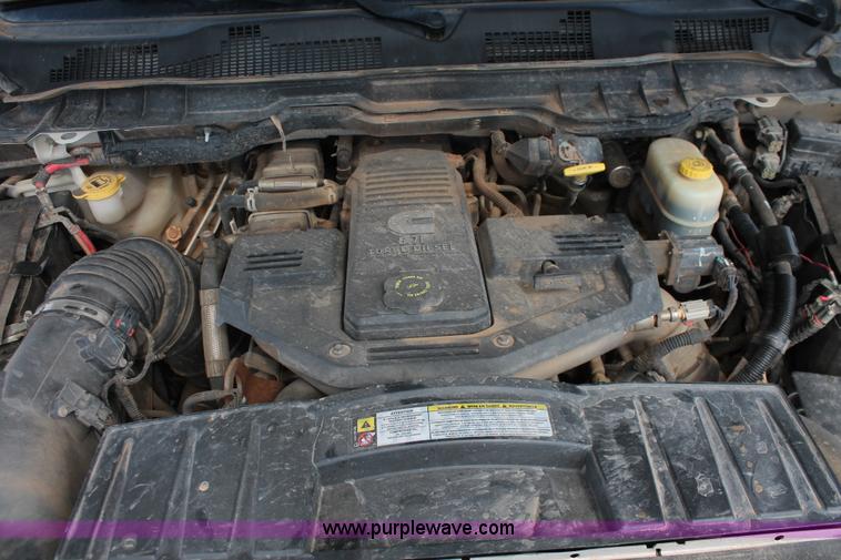 image for item K8916 2011 Dodge Ram 3500HD Quad Cab flatbed pickup truck