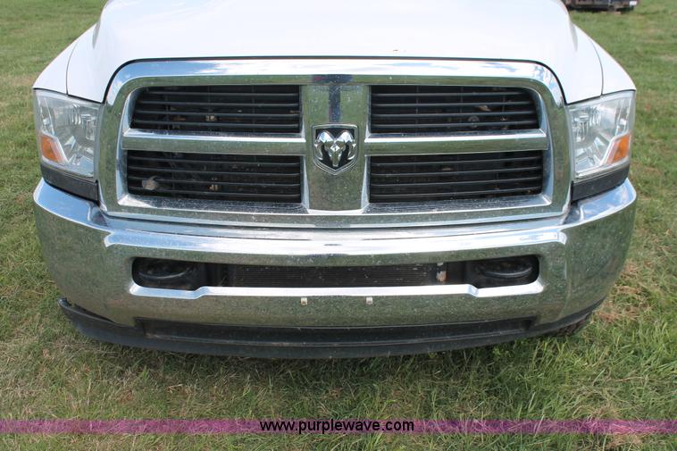 image for item K8916 2011 Dodge Ram 3500HD Quad Cab flatbed pickup truck