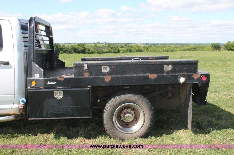 image for item K8916 2011 Dodge Ram 3500HD Quad Cab flatbed pickup truck