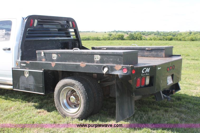 image for item K8916 2011 Dodge Ram 3500HD Quad Cab flatbed pickup truck