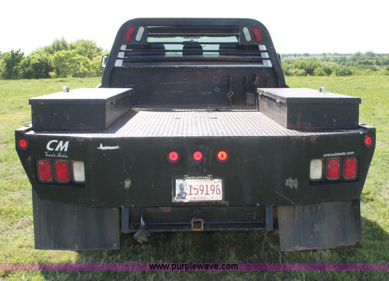 image for item K8916 2011 Dodge Ram 3500HD Quad Cab flatbed pickup truck