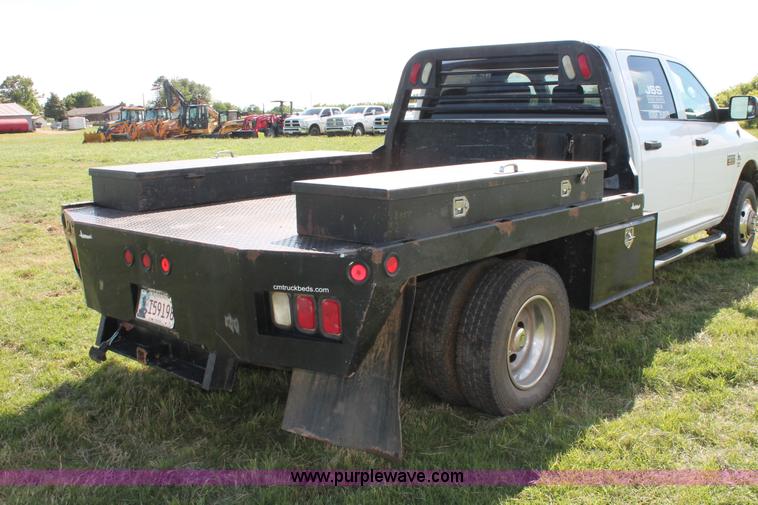 image for item K8916 2011 Dodge Ram 3500HD Quad Cab flatbed pickup truck