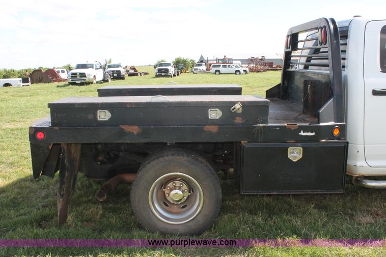image for item K8916 2011 Dodge Ram 3500HD Quad Cab flatbed pickup truck
