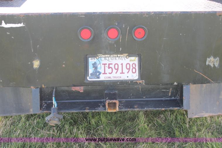 image for item K8916 2011 Dodge Ram 3500HD Quad Cab flatbed pickup truck