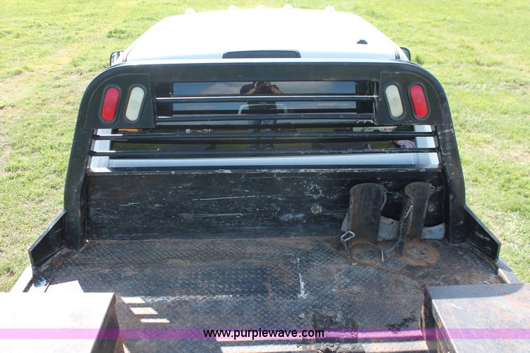 image for item K8916 2011 Dodge Ram 3500HD Quad Cab flatbed pickup truck