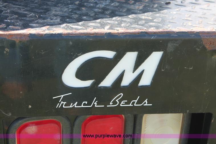 image for item K8916 2011 Dodge Ram 3500HD Quad Cab flatbed pickup truck