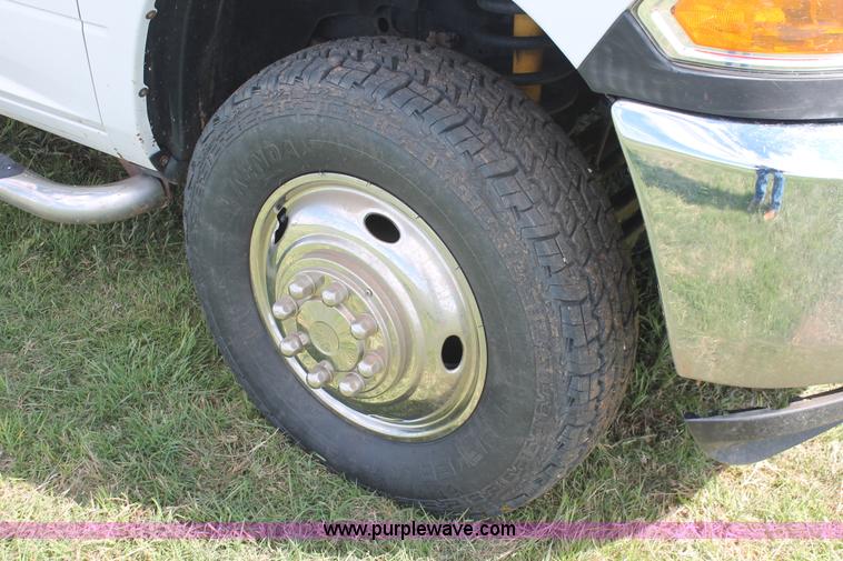 image for item K8916 2011 Dodge Ram 3500HD Quad Cab flatbed pickup truck