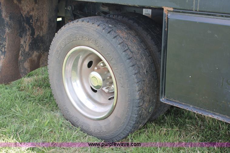 image for item K8916 2011 Dodge Ram 3500HD Quad Cab flatbed pickup truck