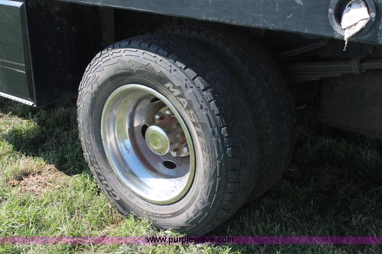 image for item K8916 2011 Dodge Ram 3500HD Quad Cab flatbed pickup truck