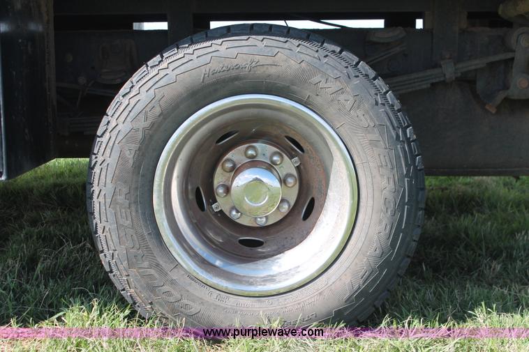 image for item K8916 2011 Dodge Ram 3500HD Quad Cab flatbed pickup truck