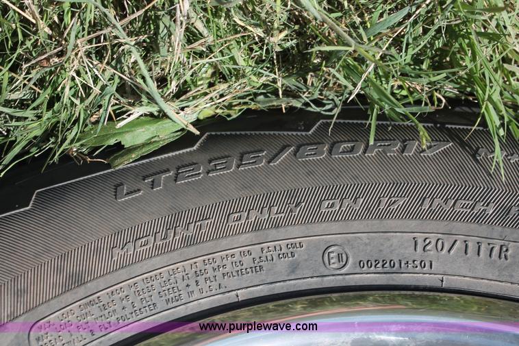 image for item K8916 2011 Dodge Ram 3500HD Quad Cab flatbed pickup truck