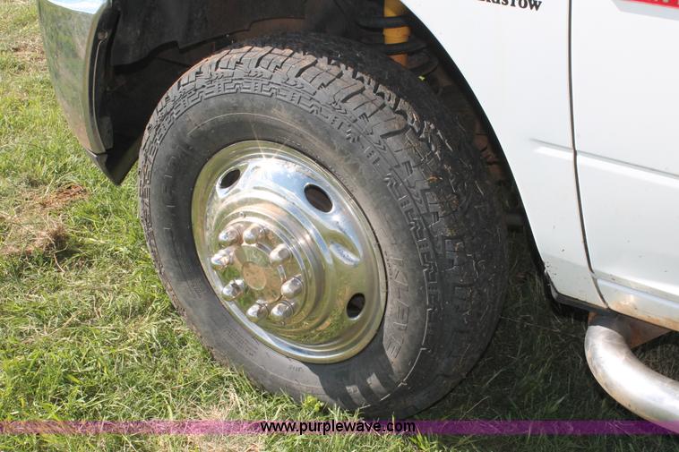 image for item K8916 2011 Dodge Ram 3500HD Quad Cab flatbed pickup truck