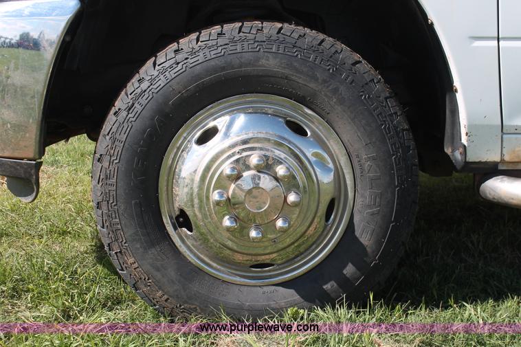 image for item K8916 2011 Dodge Ram 3500HD Quad Cab flatbed pickup truck