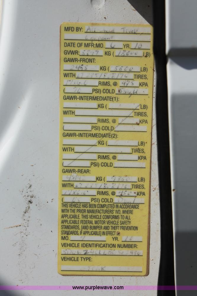 image for item K8916 2011 Dodge Ram 3500HD Quad Cab flatbed pickup truck