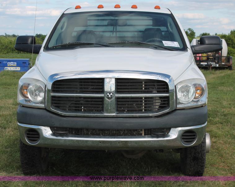 image for item K8917 2007 Dodge Ram 3500HD Quad Cab flatbed pickup truck