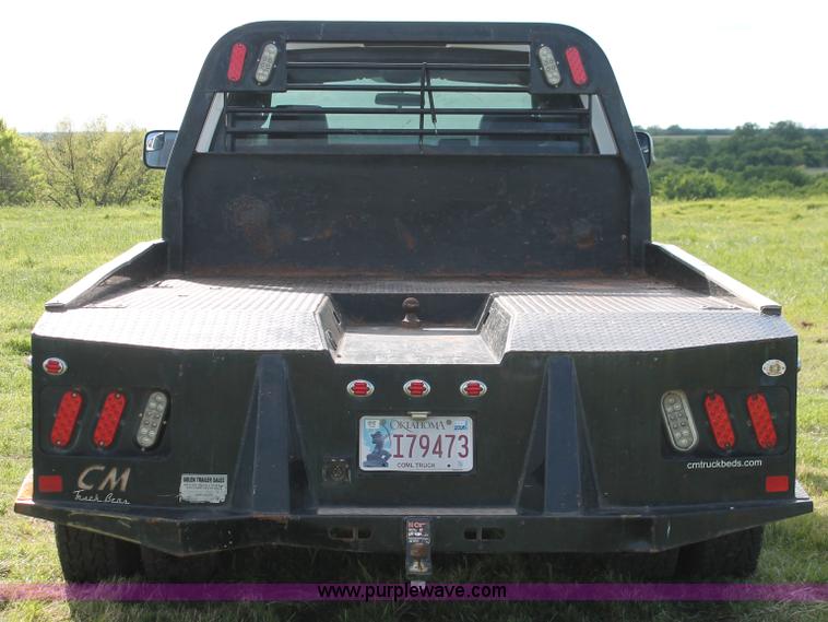 image for item K8917 2007 Dodge Ram 3500HD Quad Cab flatbed pickup truck