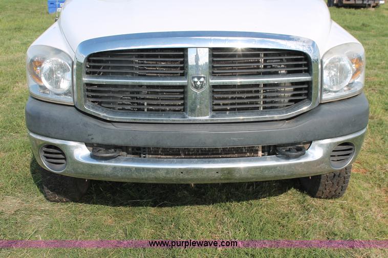 image for item K8917 2007 Dodge Ram 3500HD Quad Cab flatbed pickup truck