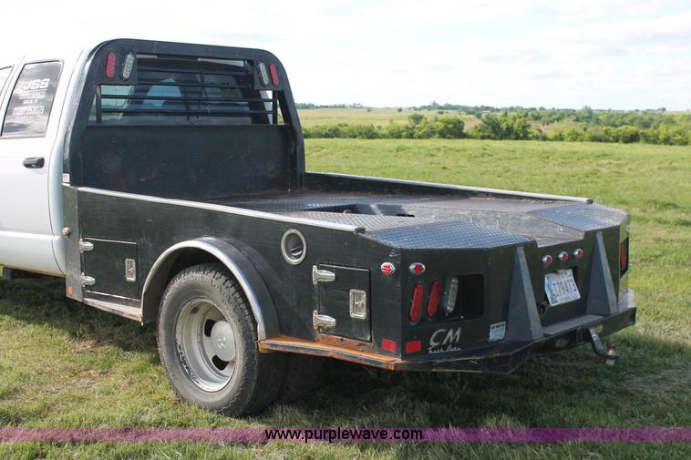 image for item K8917 2007 Dodge Ram 3500HD Quad Cab flatbed pickup truck