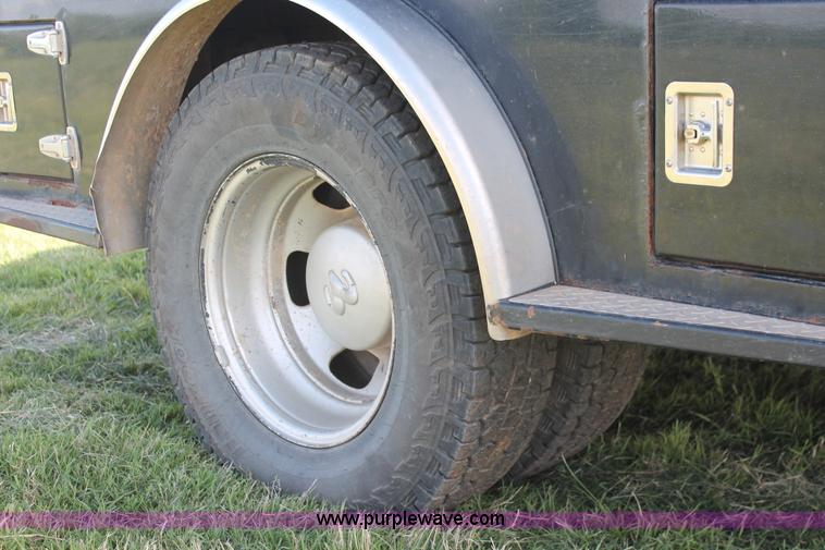 image for item K8917 2007 Dodge Ram 3500HD Quad Cab flatbed pickup truck