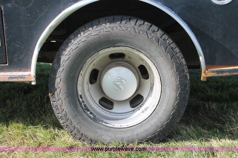 image for item K8917 2007 Dodge Ram 3500HD Quad Cab flatbed pickup truck