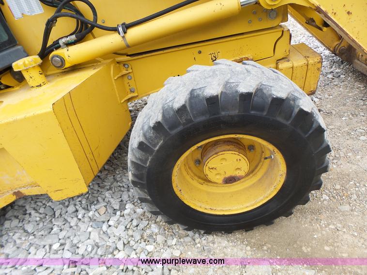 image for item L6054 2004 John Deere 310 SG backhoe