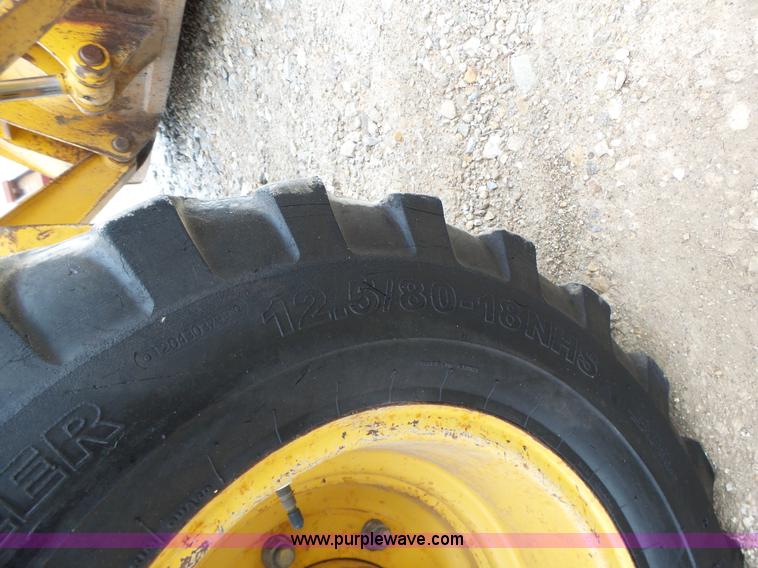 image for item L6054 2004 John Deere 310 SG backhoe