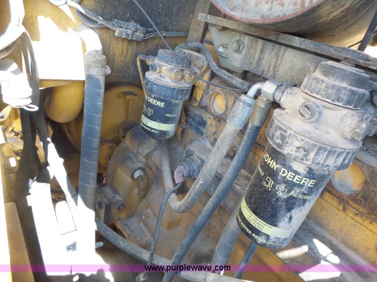 image for item L7236 1999 John Deere 624H wheel loader