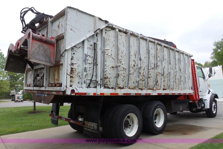 image for item AM9527 2004 Sterling L8500 Acterra Grapple truck