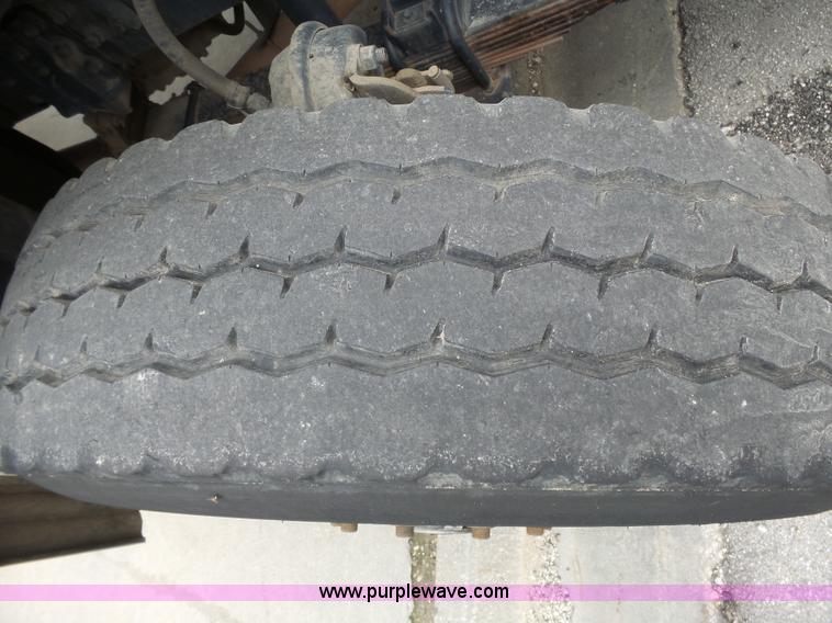 image for item AM9527 2004 Sterling L8500 Acterra Grapple truck