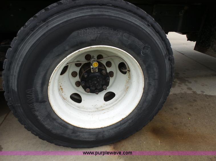 image for item AM9527 2004 Sterling L8500 Acterra Grapple truck