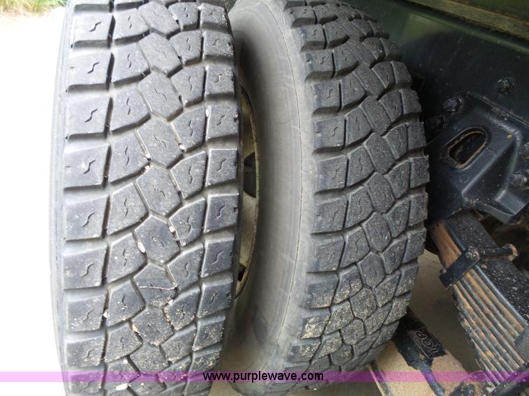 image for item AM9527 2004 Sterling L8500 Acterra Grapple truck