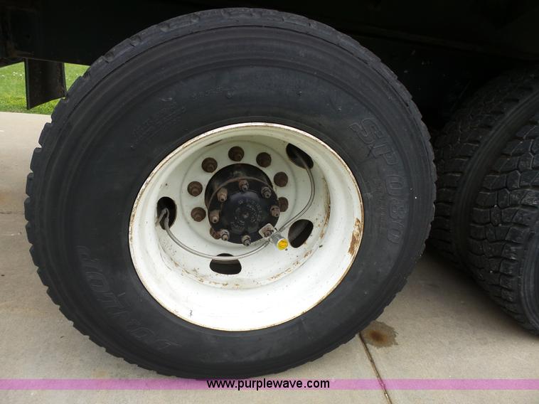 image for item AM9527 2004 Sterling L8500 Acterra Grapple truck