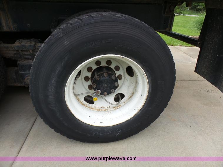 image for item AM9527 2004 Sterling L8500 Acterra Grapple truck