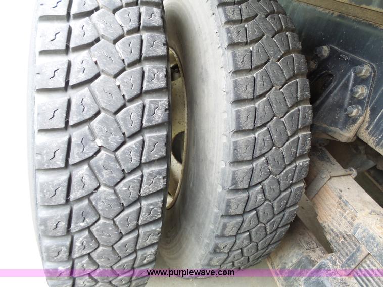 image for item AM9527 2004 Sterling L8500 Acterra Grapple truck