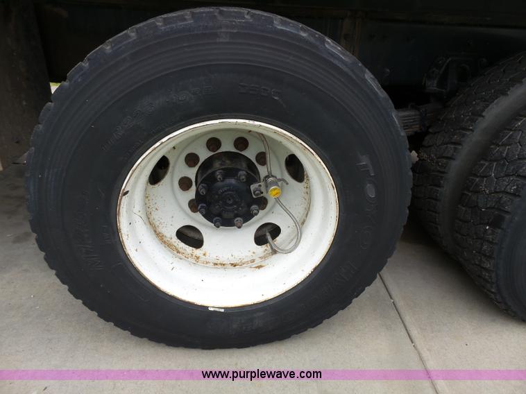 image for item AM9527 2004 Sterling L8500 Acterra Grapple truck