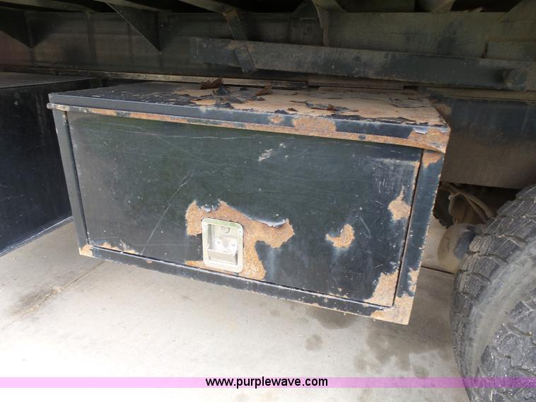 image for item AM9527 2004 Sterling L8500 Acterra Grapple truck