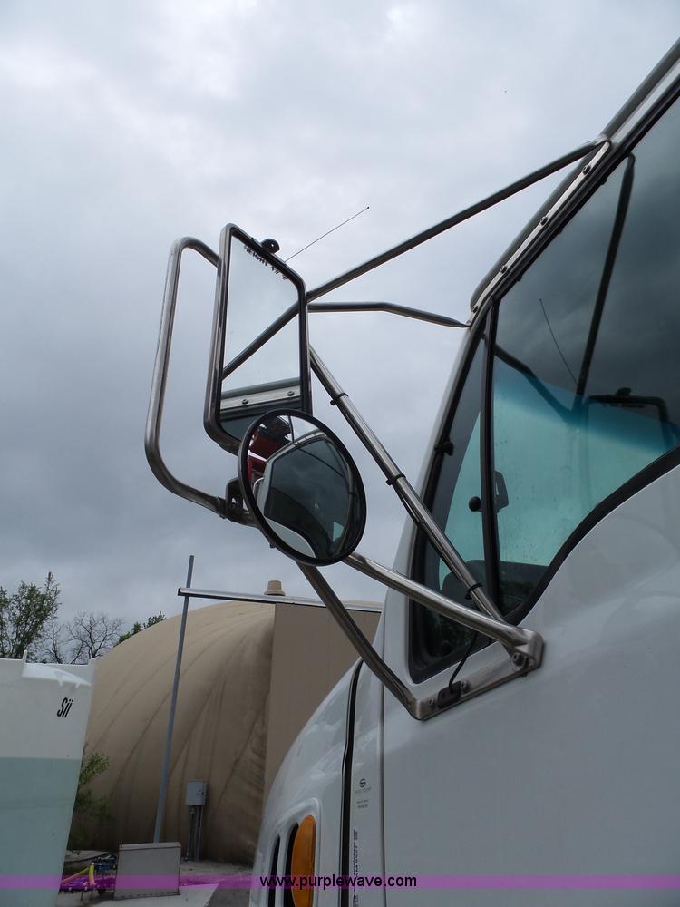 image for item AM9527 2004 Sterling L8500 Acterra Grapple truck