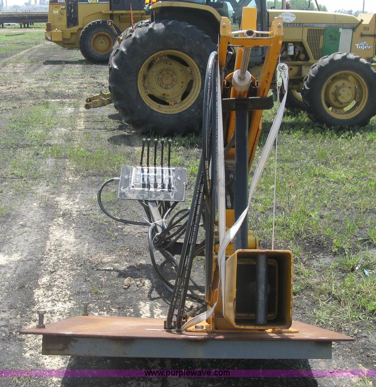 Hydraulic guard rail post driver attachment in McPherson, KS Item