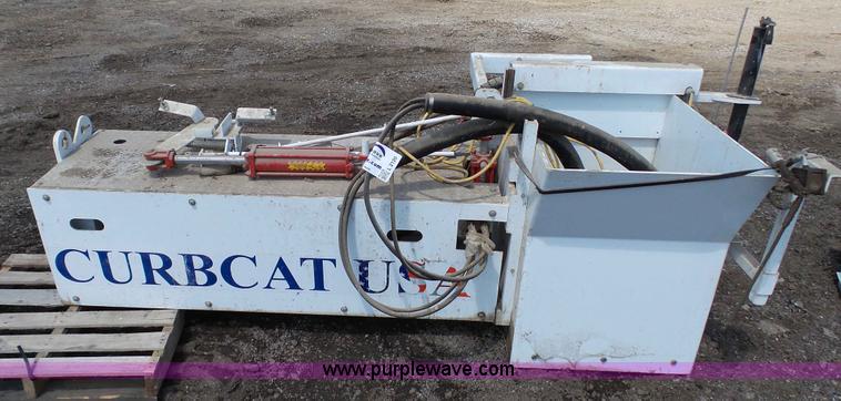 image for item L2120 CurbCat 450D curb and gutter slip forming skid steer attachment