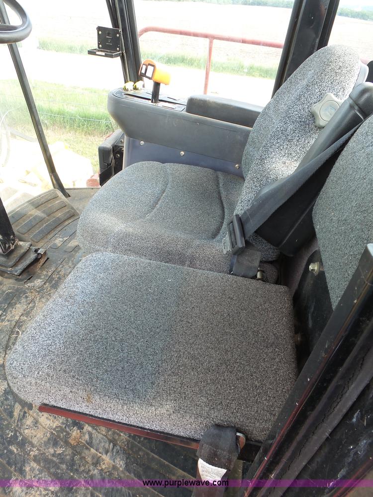 image for item J4935 2003 New Holland HW340 self-propelled windrower