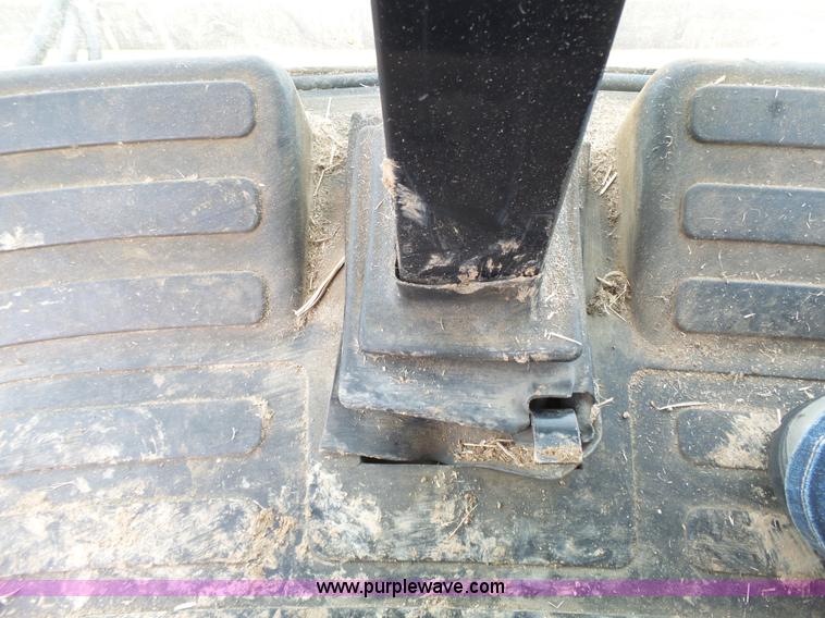 image for item J4935 2003 New Holland HW340 self-propelled windrower