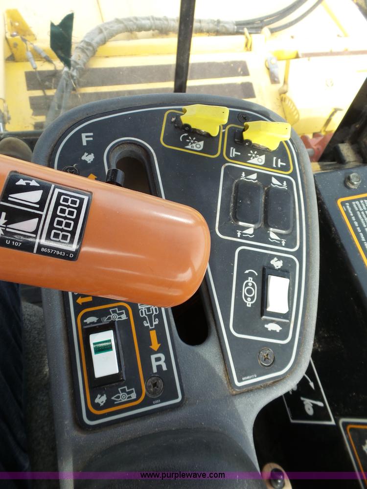 image for item J4935 2003 New Holland HW340 self-propelled windrower