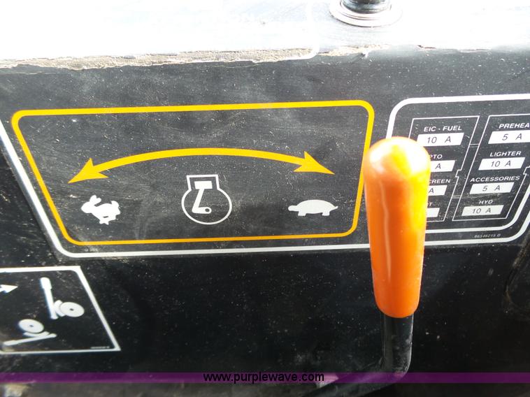 image for item J4935 2003 New Holland HW340 self-propelled windrower