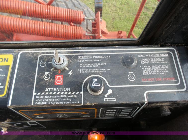 image for item J4935 2003 New Holland HW340 self-propelled windrower