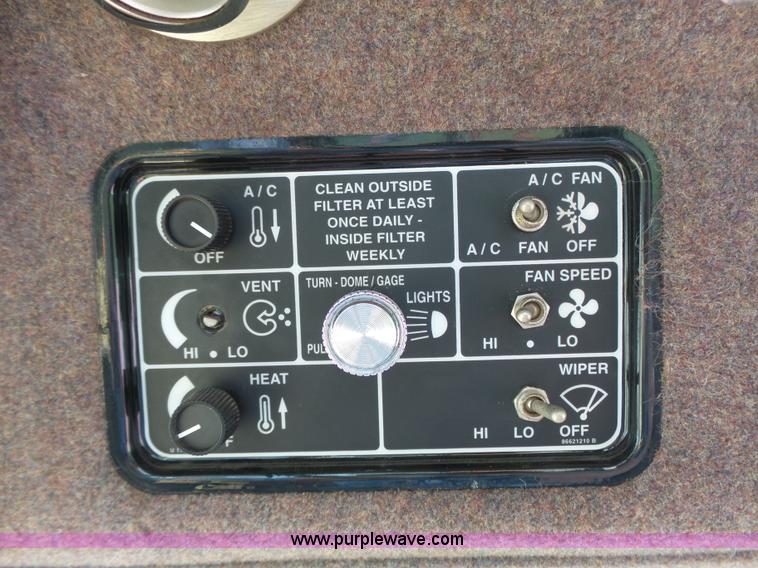 image for item J4935 2003 New Holland HW340 self-propelled windrower